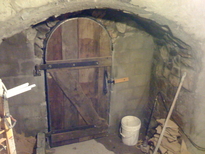 hobbit house construction formwork concrete dome entrance door wrought iron hinges